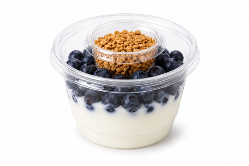 Yogurt cup with blueberries and granola topping